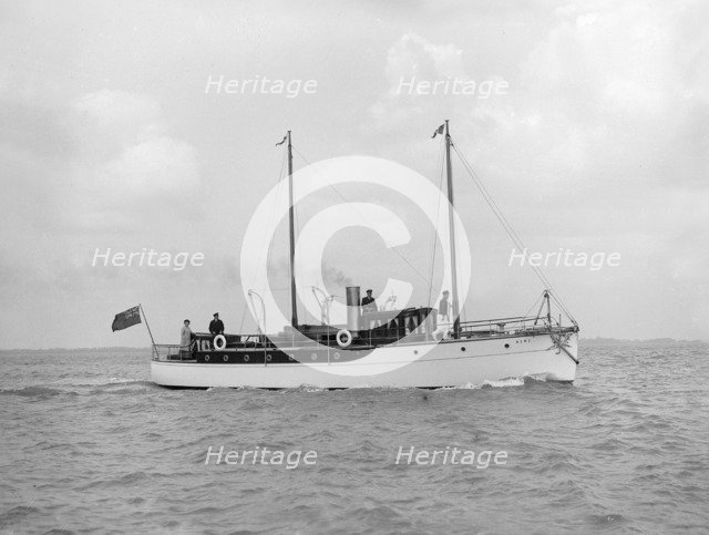 The 23 ton motor yacht 'Kiwi' under way, 1914. Creator: Kirk & Sons of Cowes.