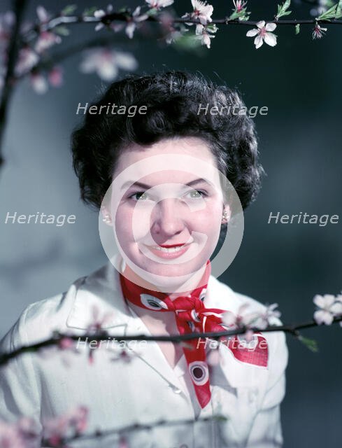 Woman wearing a red neck scarf, c1955.  Creator: Arthur Charles Kirby Ware.