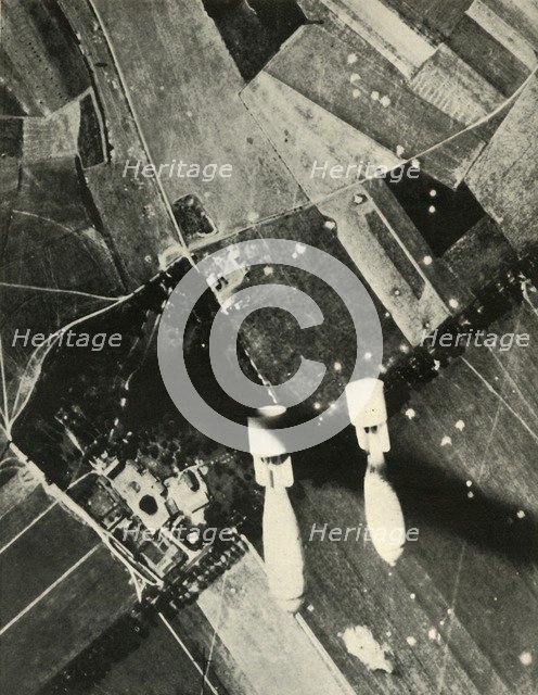 'More British Bombs on an Enemy-Held Aerodrome', 1939-1940, (1941). Creator: Unknown.
