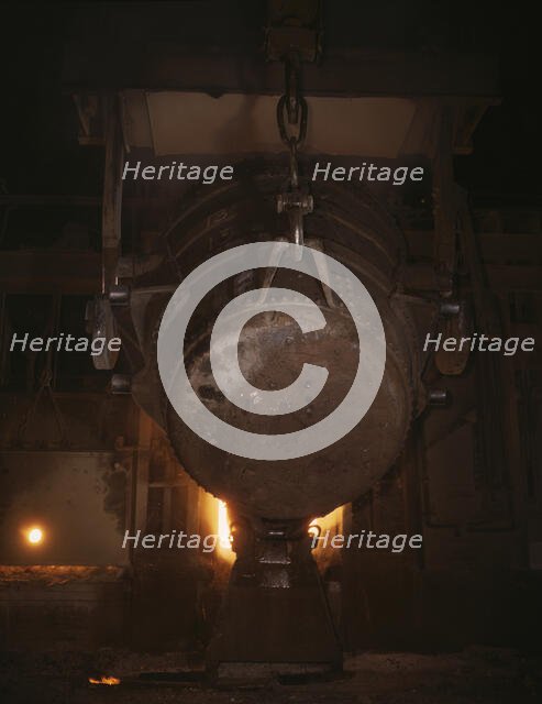 Ladle of molten iron is poured into..., Allegheny Ludlum Steele Corp., Brackenridge, Pa., (1941?). Creator: Alfred T Palmer.