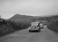 Ford V8 saloon of HJ Parsons competing in the South Wales Auto Club Welsh Rally, 1937 Artist: Bill Brunell.