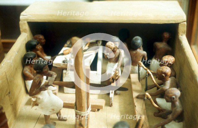 Carpenters in a workshop, model figures from an Ancient Egyptian tomb. Artist: Unknown