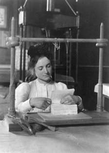 Woman doing bookbinding at Roycroft Shops, E. Aurora, N.Y., 1900. Creator: Frances Benjamin Johnston.