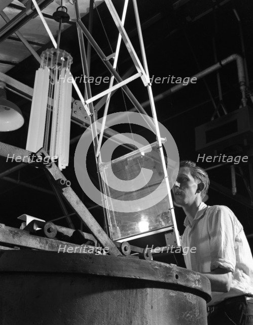 Heat treating hacksaw blades, Slack Sellers & Co Ltd, Sheffield, South Yorkshire, 1963. Artist: Michael Walters