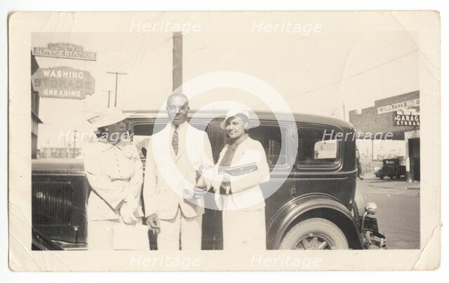 Photographic print of Mr. and Mrs. Jackson and another woman in front of car, 1926. Creator: Unknown.