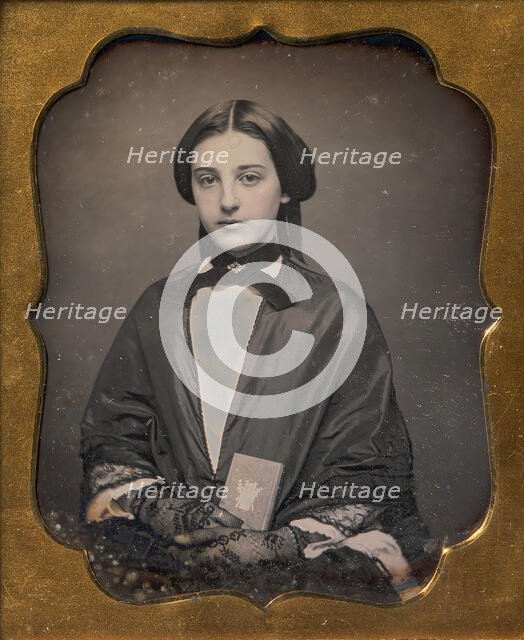 Young Woman Wearing Lace Gloves Holding a Daguerreotype Case, 1860s. Creator: Unknown.