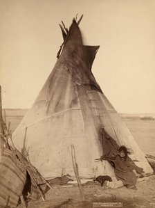 A young Oglala girl sitting in front of a tipi, with a puppy.... Pine Ridge Reservation, 1891. Creator: John C. H. Grabill.