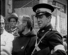 An Irish Priest Talking to a Soldier in a Car, Trying to Bring Peace, 1922. Creator: British Pathe Ltd.