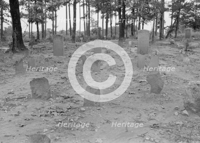 A red clay Negro cemetery, Bethel Hill High School, Person County, North Carolina, 1939. Creator: Dorothea Lange.