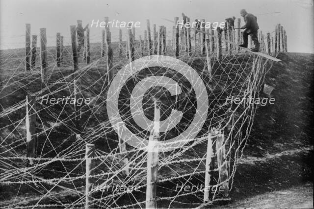 Germans fixing barbed wire tangle, between c1914 and c1915. Creator: Bain News Service.