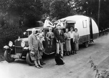 Family group with their 1930 Fiat towing a caravan, (c1930?). Artist: Unknown