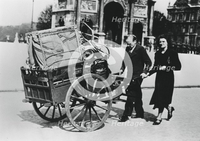 French refugees returning home after the fall of France to the Germans, Paris, July 1940. Artist: Unknown