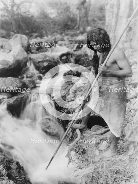 Watching for salmon-Hupa, c1923. Creator: Edward Sheriff Curtis.