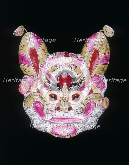 A tiger face mask painted with garish colours, China, 20th century. Artist: Unknown