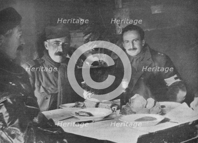 'Red Cross officers at dinner in a dug-out', 1914. Artist: Unknown.