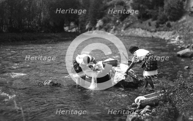 Women washing their laundry in a river, Bistrita Valley, Moldavia, north-east Romania, c1920-c1945. Artist: Adolph Chevalier