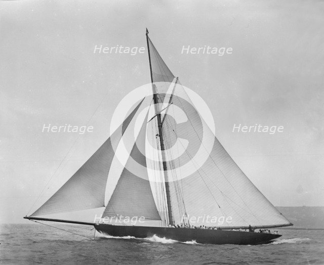 The cutter 'Shamrock' beating to windward. Creator: Kirk & Sons of Cowes.