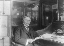 Man (banker?) seated at desk at American Security and Trust Co., Washington, D.C., c1890 - c1950. Creator: Frances Benjamin Johnston.