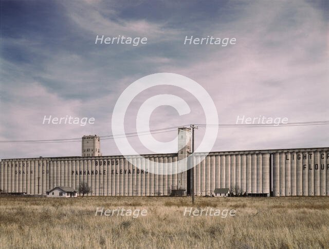Grain elevators along the route of the Atchison, Topeka, and Santa Fe RR, Amarillo, Texas, 1943. Creator: Jack Delano.