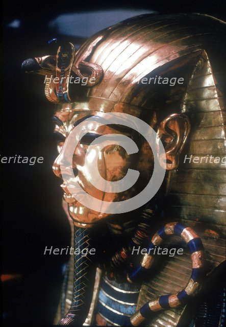 Gold mask of Tutankhamun on the second coffin. Artist: Unknown