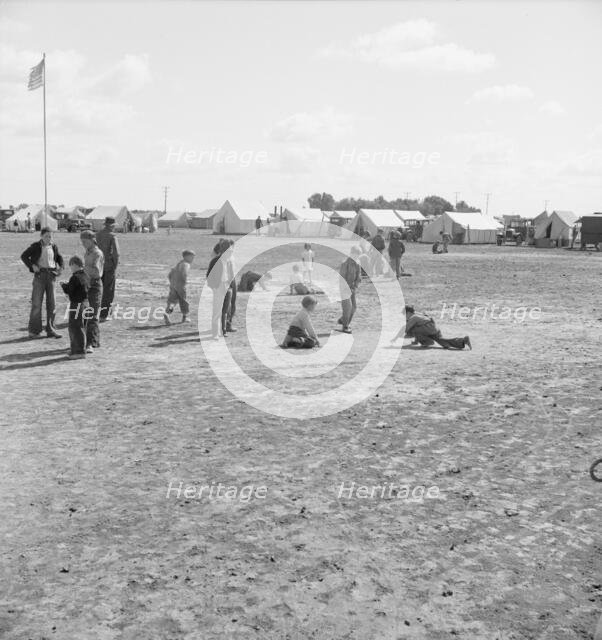 Marble time in FSA migratory labor camp, near Calipatria, Imperial Valley, CA, 1939. Creator: Dorothea Lange.