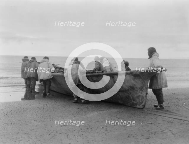 Launching the whale boat-Cape Prince of Wales, c1929. Creator: Edward Sheriff Curtis.