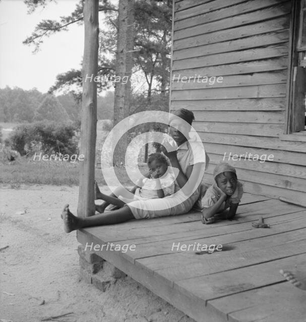 Possibly: Tobacco sharecropper's daughter getting eggs..., Person County, North Carolina, 1939. Creator: Dorothea Lange.