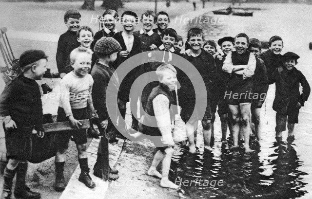 A group of summer paddlers in the Serpentine, London, 1926-1927. Artist: Unknown