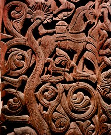 Detail of a carving from a stave church portal illustrating the story of Sigurd.