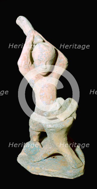 Greek terracotta statuette of a butcher with a pig. Artist: Unknown