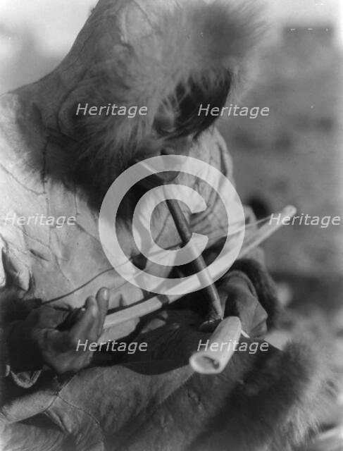 Drilling ivory-King Island, c1929. Creator: Edward Sheriff Curtis.