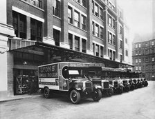 A fleet of Lyons delivery vans, Cadby Hall, West Kensington, London. Artist: Unknown