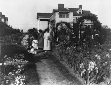 Seven women and two small girls in the garden of Mrs. John W. Paris...New York, between 1909 & 1927. Creator: Frances Benjamin Johnston.