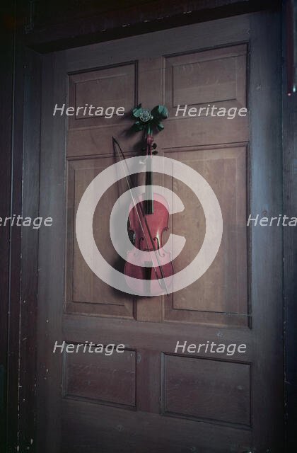 Violin on a door painted by Jan van der Vaart, Chatsworth House, Derbyshire, c1955. Creator: Arthur Charles Kirby Ware.