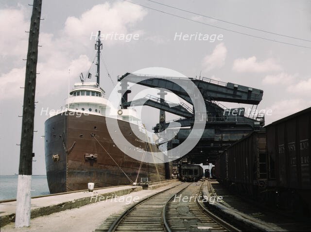 Pennsylvania R.R. ore docks, unloading iron ore from a lake freighter..., Cleveland, Ohio, 1943. Creator: Jack Delano.