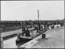 Two canal barges passing through a lock on the Grand Union Canal near Marsworth, Bucks, 1920-50.  Creator: George R Long.
