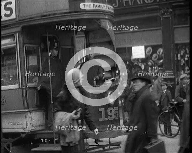 Volunteer Male Civilian Conducting a Tram With a Police Escort Sitting Beside Him, 1926. Creator: British Pathe Ltd.