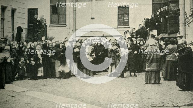 Russian soldiers' wives waiting for news from the Front..., First World War, 1915, (c1920). Creator: Unknown.
