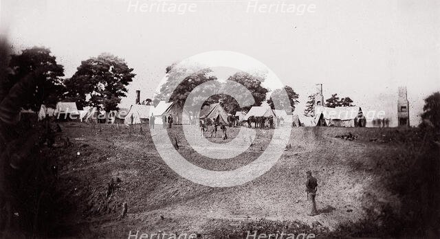 [Unidentified camp with ruined chimneys in background]. Brady album, p. 130, 1861-65. Creator: Unknown.