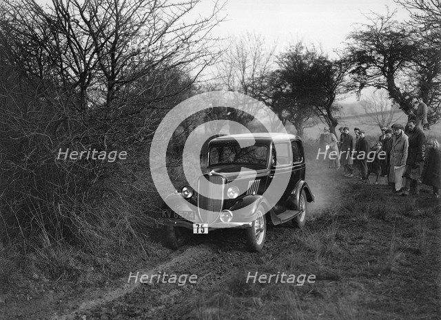 EGH Arnold's Ford Model Y, Sunbac Colmore Trial, near Winchcombe, Gloucestershire, 1934. Artist: Bill Brunell.