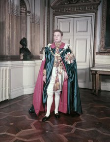 A model wearing the mantle and insignia of the Order of St Michael and St George, c1950s. Creator: Arthur Charles Kirby Ware.