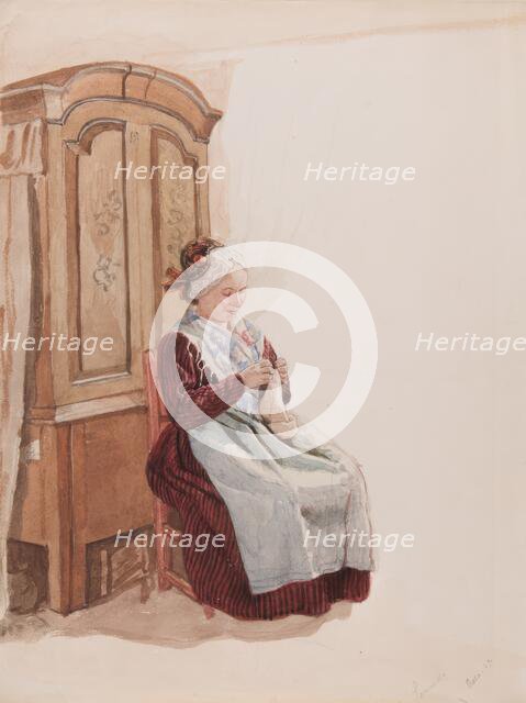 Apparel - Handicraft woman in full figure sitting in front of a cupboard. (c1900s). Creator: AJG Virgin.