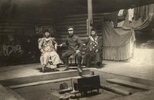 The interior of a Buryat yurt. In the center is a householder with two wives, 1905. Creator: L Veniukov.