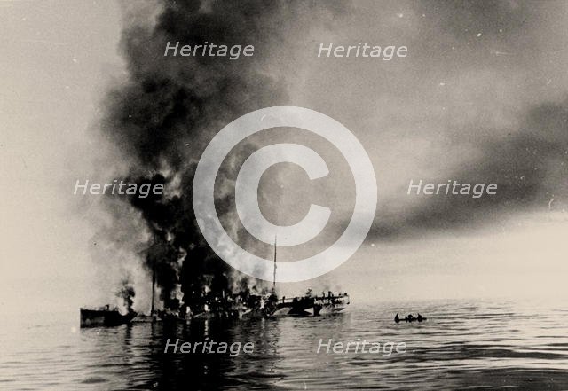 The sinking of icebreaker Alexander Sibiryakov by German cruiser Admiral Scheer on 25 August 1942. Creator: Anonymous.