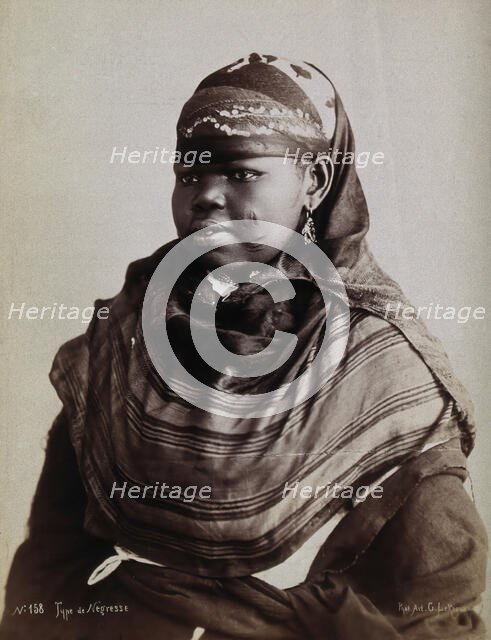 A North African woman with scarification on her cheeks, c1900. Creator: Gabriel Lekegian.