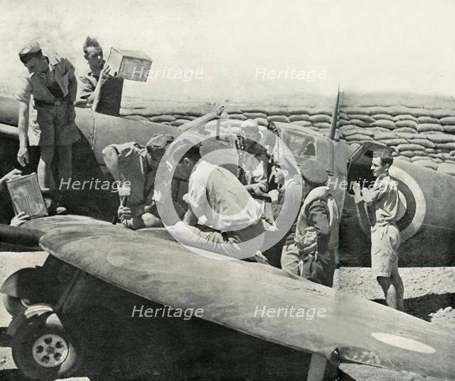 Refuelling and re-arming Spitfire fighters, Malta, World War II, 1942 (1944). Creator: Unknown.