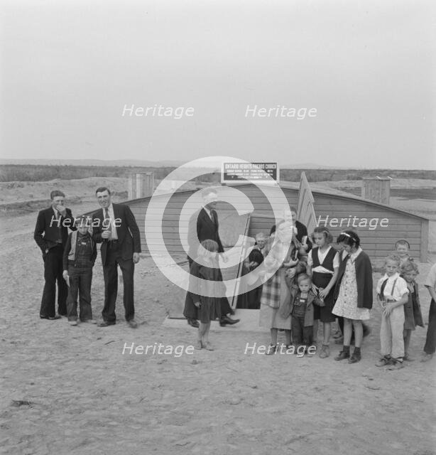 Congregation leaving after services, Dead Ox Flat, Oregon, 1939. Creator: Dorothea Lange.
