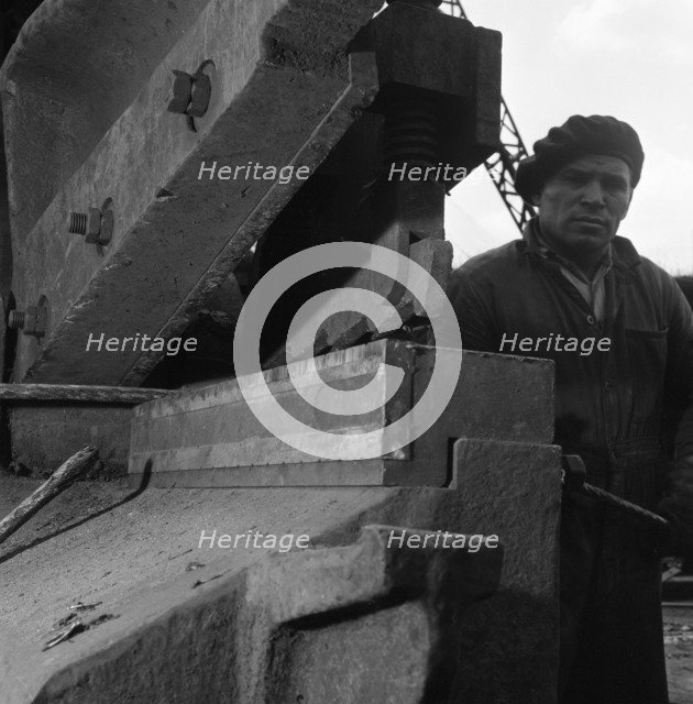 Scrapyard worker, Rotherham, South Yorkshire, 1963. Artist: Michael Walters