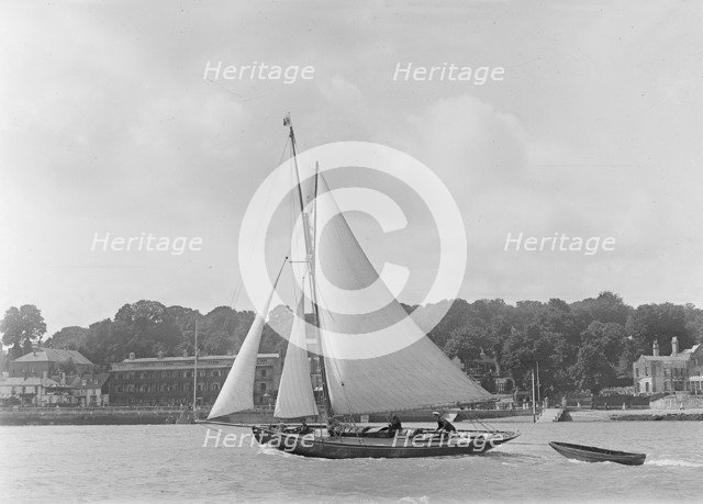 The 9 ton auxilary cutter 'Grayling' with  tender, 1921. Creator: Kirk & Sons of Cowes.