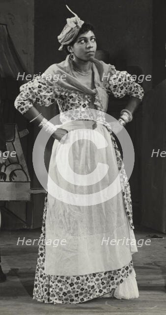 Sybil Moore portraying a typical West Indian character, 1937. Creator: Unknown.